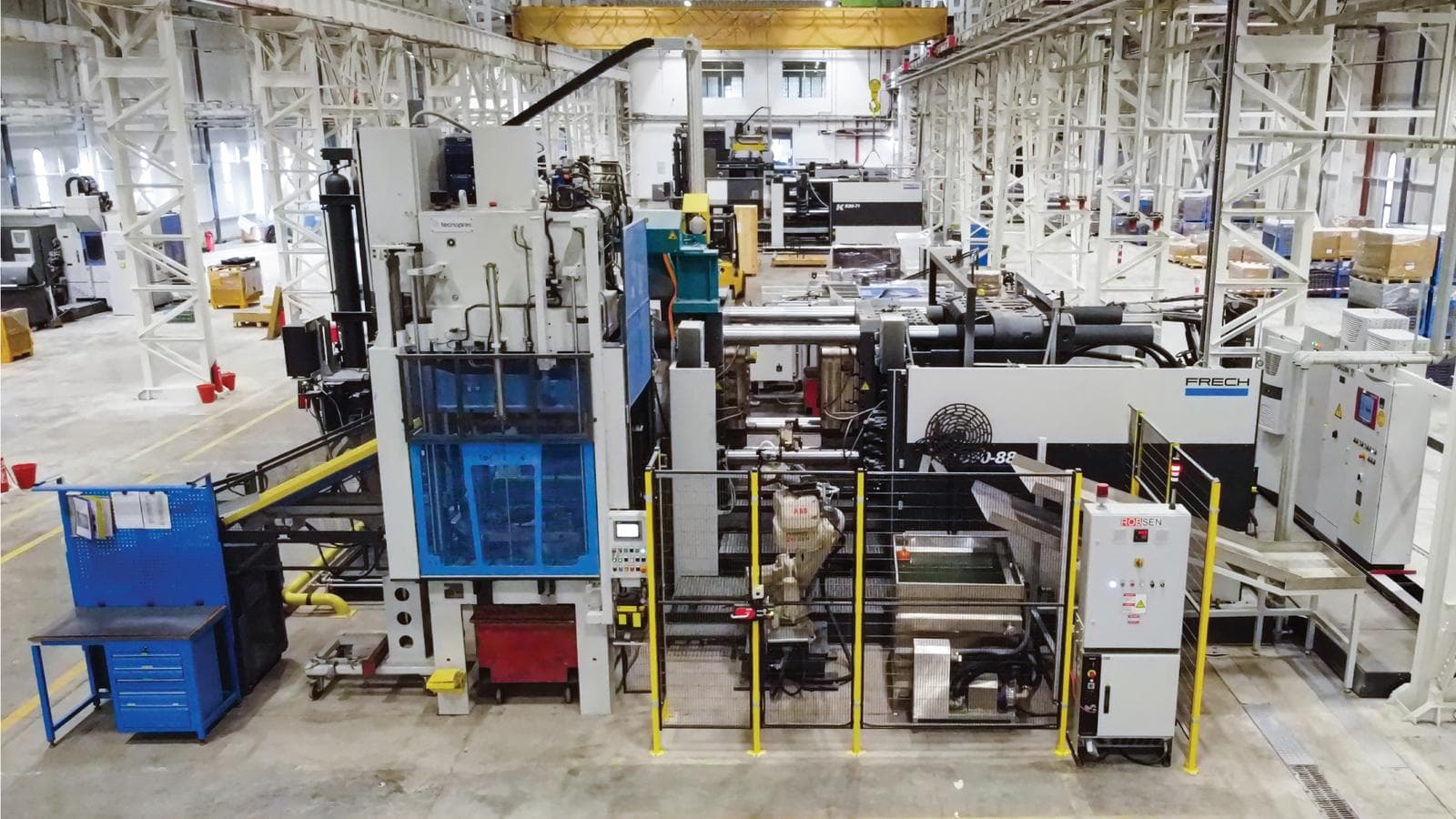 A robot-integrated high-pressure die casting cell, the first of a fourteen-machine investment.